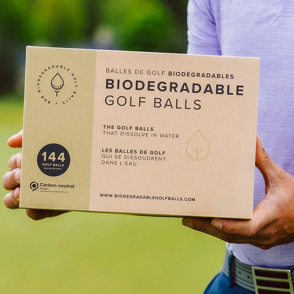 Our biggest pack of biodegradable golf balls being held by a golfer.