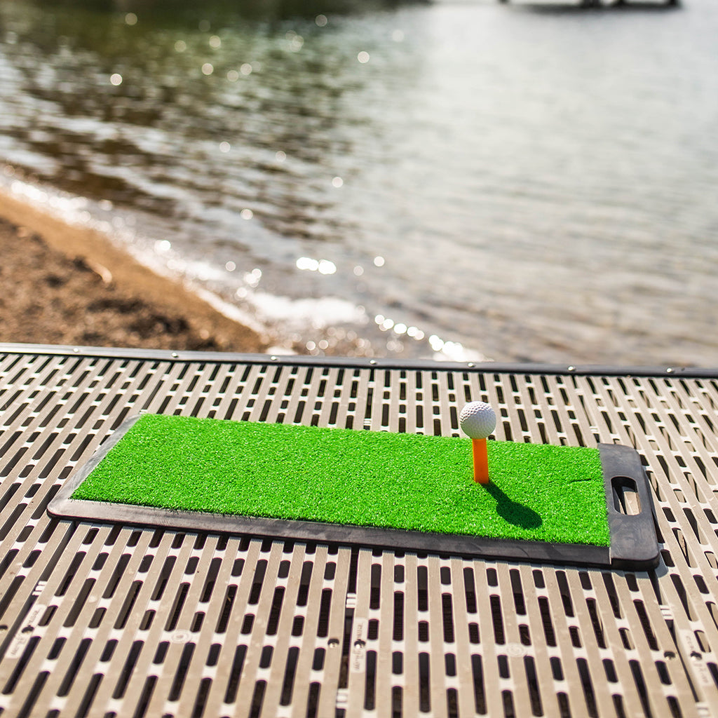 Bring a golf practice mat out to the dock for hitting our biodegradable golf balls into water!